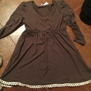 Brown, lace trimmed dress with pockets.